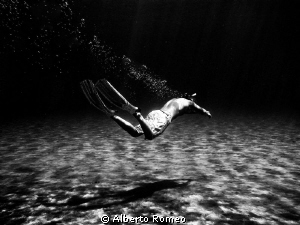 My son   swimming underwater in apnea. Mediterranean sea-... by Alberto Romeo 